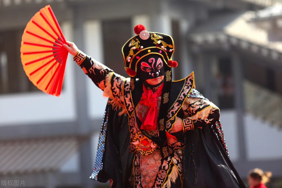 Traditional Sichuan opera performer with face-changing mask