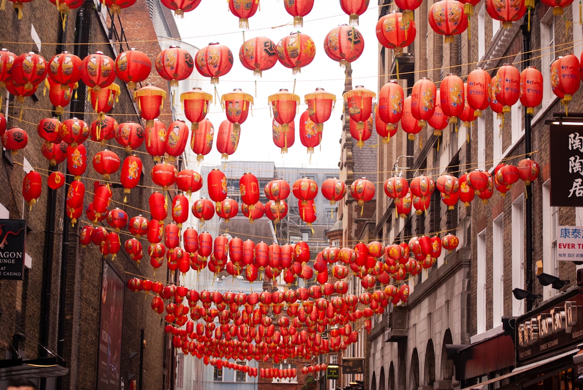 A city street covered in red Chinese lanterns during the Spring Festival season
