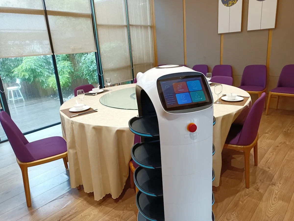 A food delivery robot at a restaurant table in China