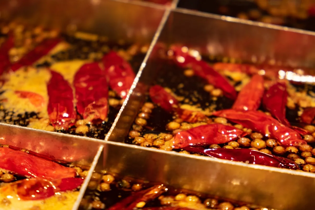 Chongqing hot pot ingredients — thinly sliced meats and tripe ready for the bubbling chili broth