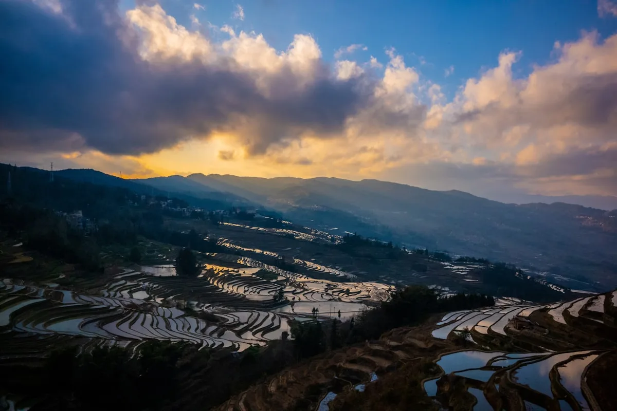 Sunset over terraced rice fields in the mountains of southern China