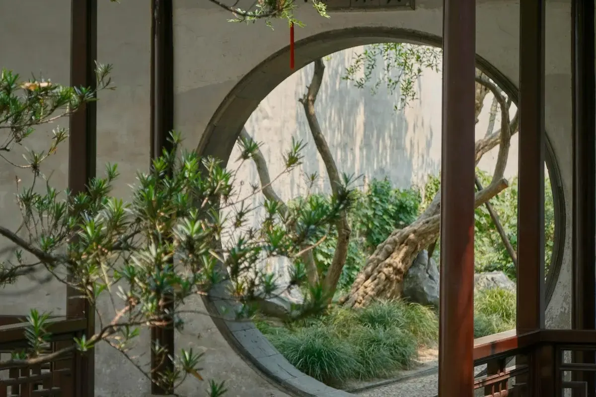 Traditional Chinese garden in Suzhou, distant view through a circular moon gate