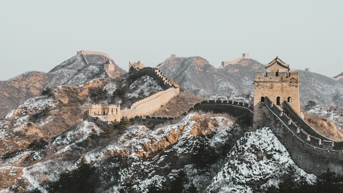 The Great Wall of China winding along a snowy mountain ridge