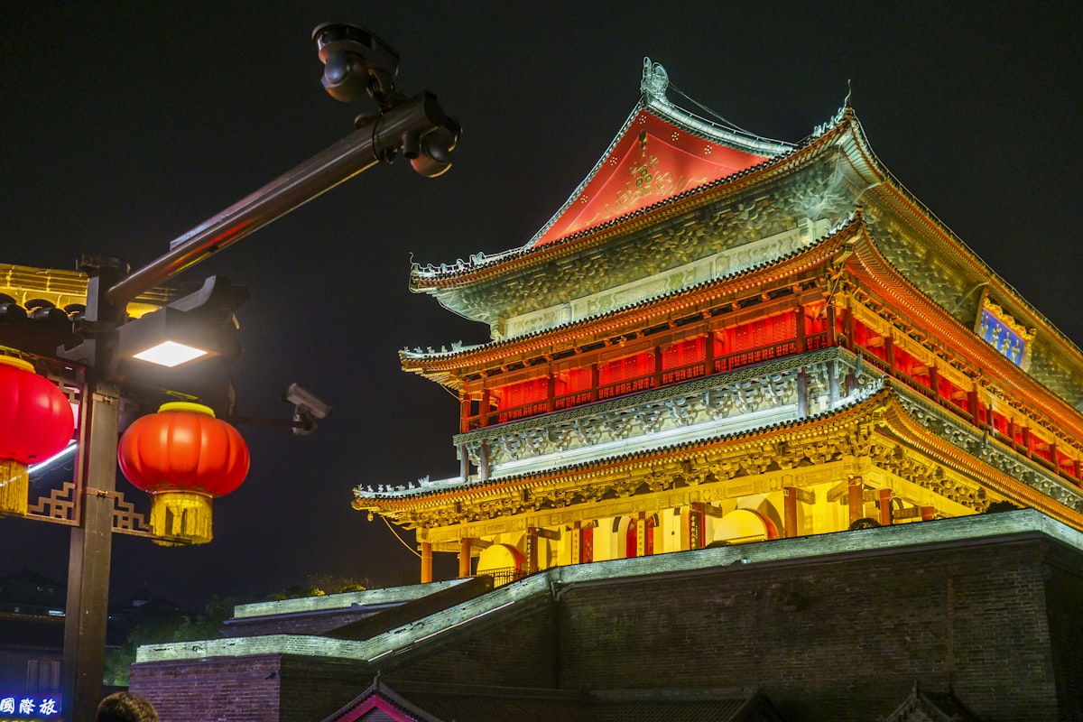 Ancient Chinese building lit up with red lanterns at night in Xi'an