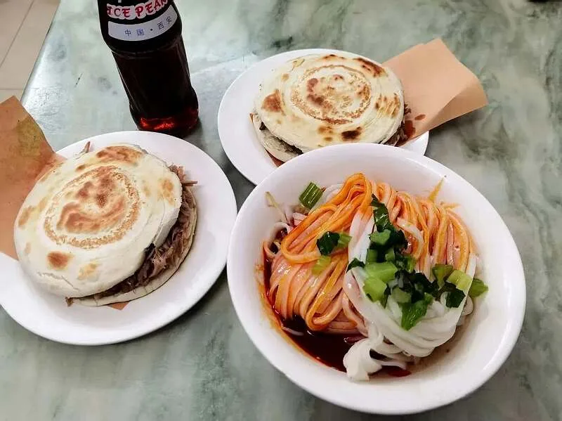 Xi'an street food including roujiamo and noodles