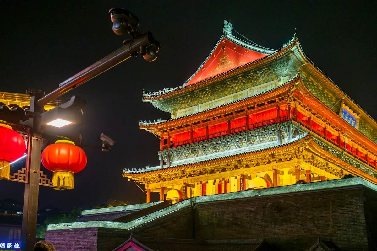Ancient Chinese building lit up with red lanterns at night in Xi'an