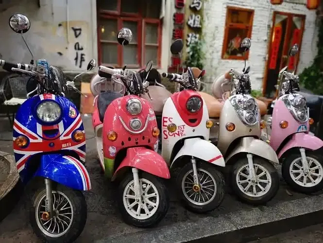 Electric scooters parked on the street, waiting for renters