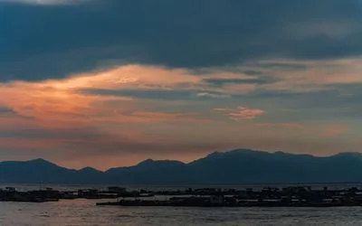 Sunset over mountains and water along the Fujian coastline