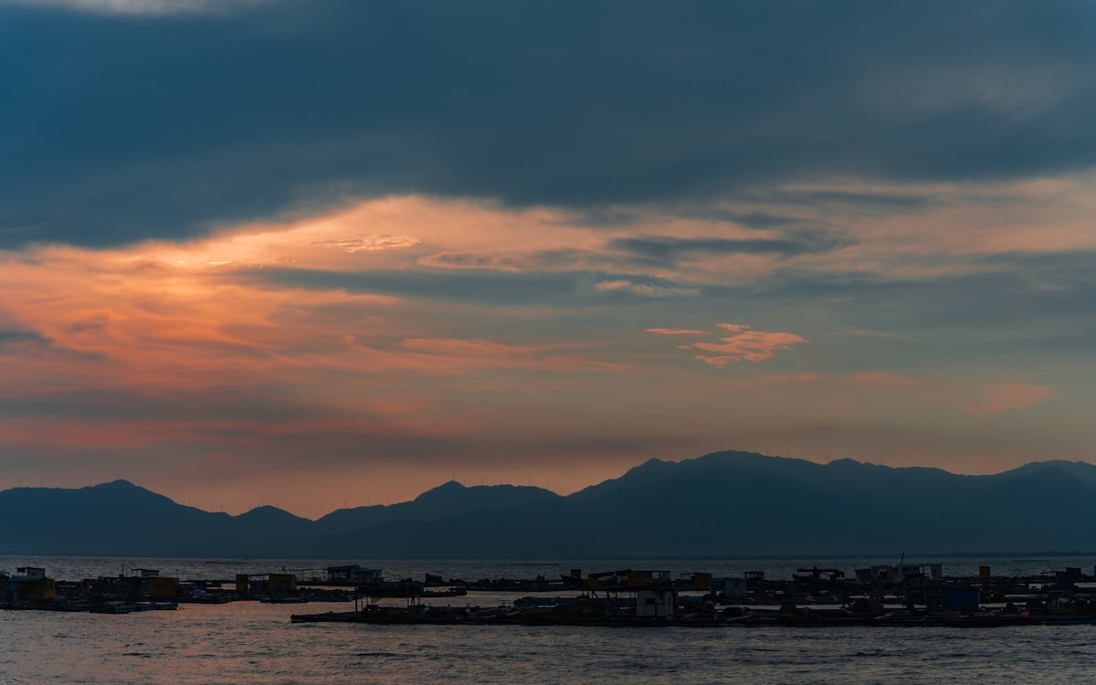 Sunset over mountains and water along the Fujian coastline