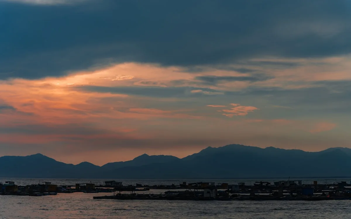 Sunset over mountains and water along the Fujian coastline