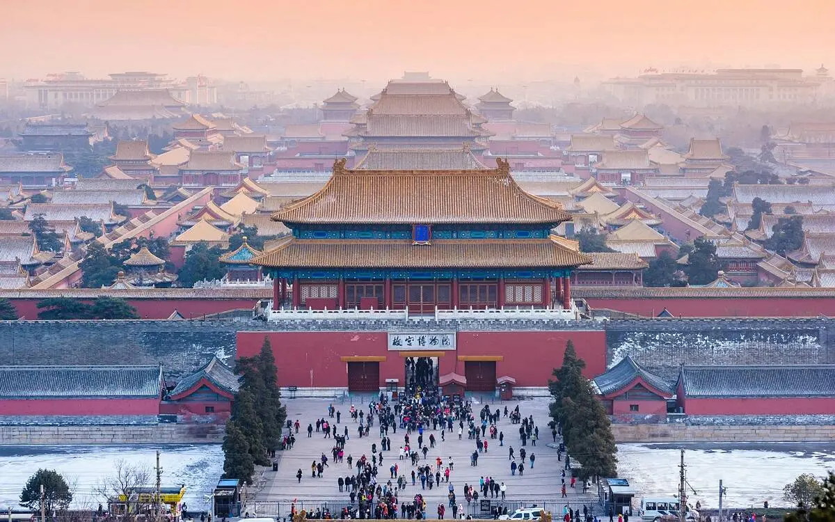 Forbidden City imperial palace roofs against a bright sky