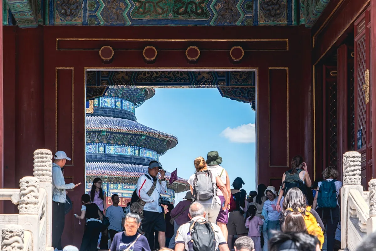 Tourists walking through the gate of the Temple of Heaven during Golden Week