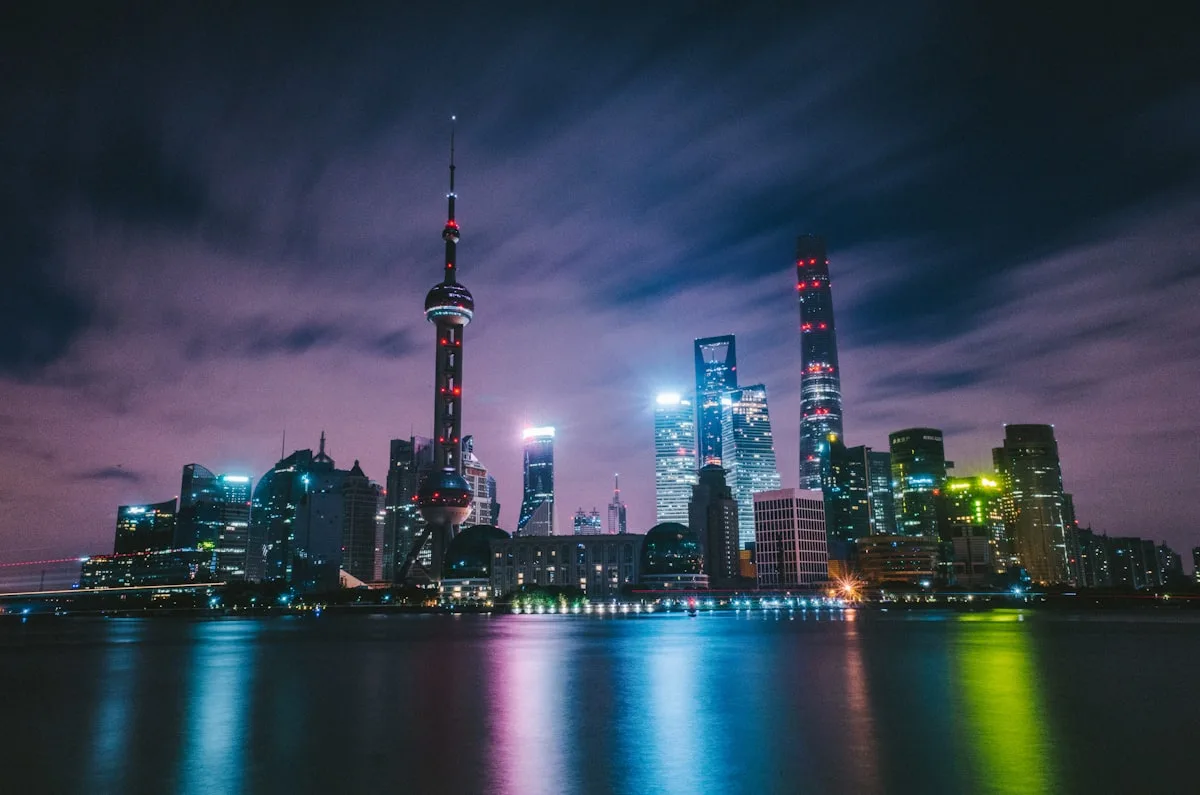 The Shanghai skyline at night with the Oriental Pearl Tower