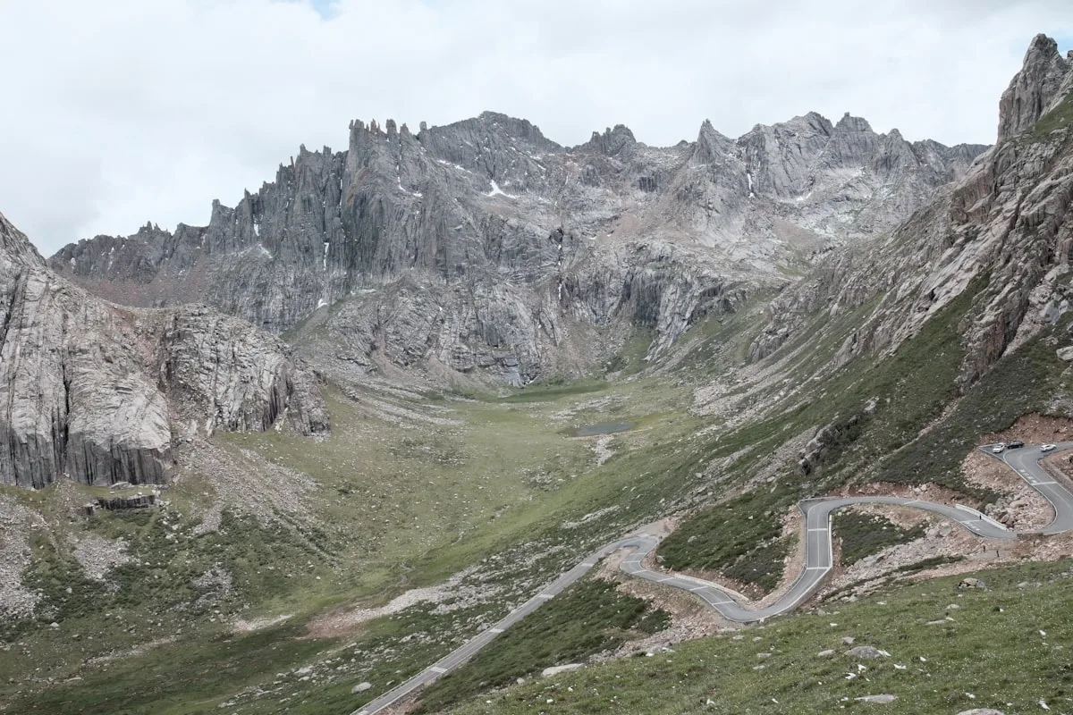 Winding road through a rocky mountain valley