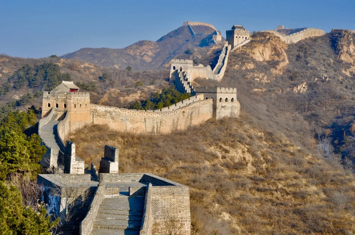 Jinshanling Great Wall at sunrise: the wall snakes along mountain ridges with 67 watchtowers, the densest concentration of any section