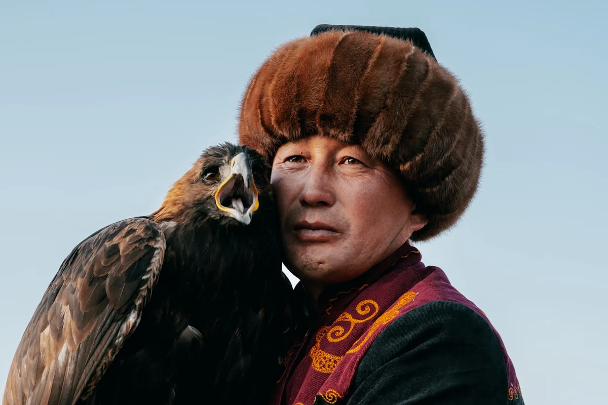 Man in traditional clothing with a golden eagle
