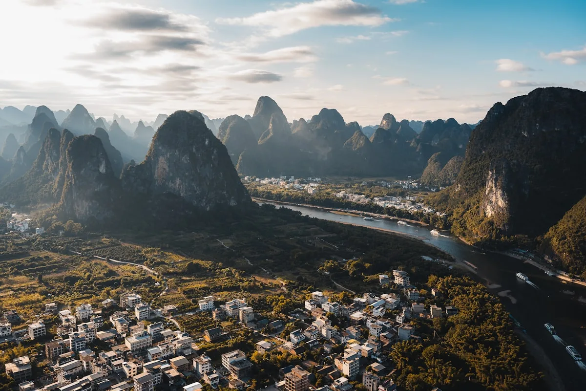 Xianggong Mountain sunrise panorama: the Li River S-bend winding through a forest of karst peaks at dawn