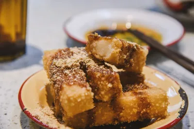 Fried rice cake dusted with soybean powder, a Chinese vegetarian snack