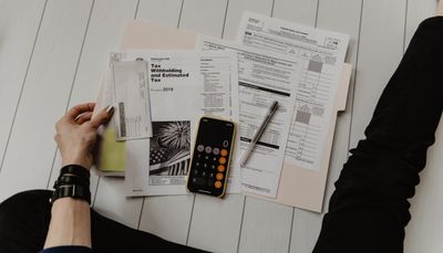 Chinese visa application form and passport on a desk