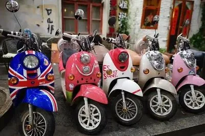 Electric scooters parked on the street, waiting for renters
